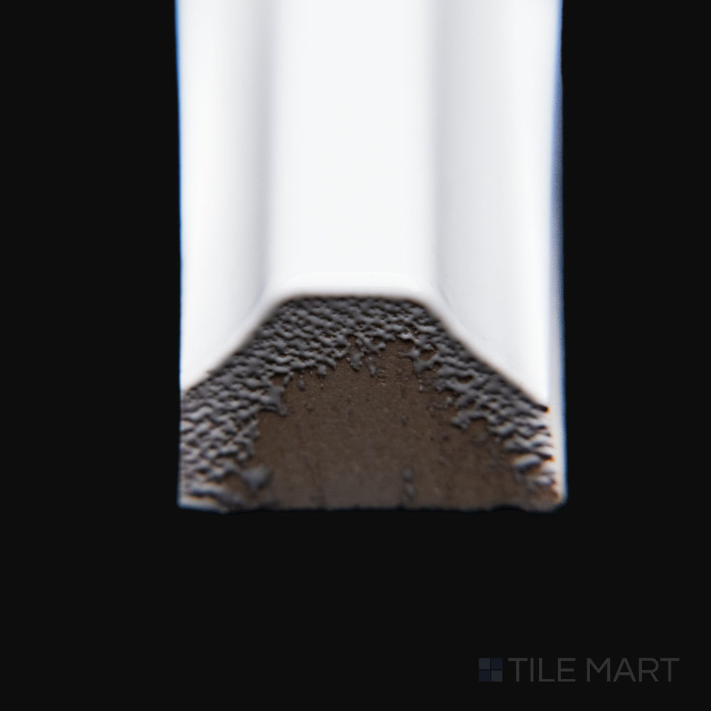 A close-up corner shot of Maiolica White 0.5X10 bright ceramic pencil, showcasing its crisp white color, smooth rounded edge, and glossy finish.