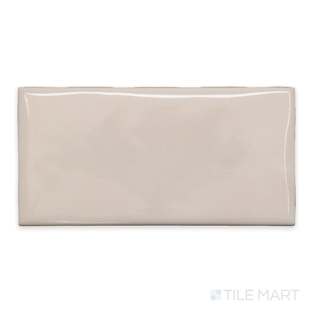 An overview of Maiolica Biscuit 3x6 bright ceramic bullnose, featuring a warm neutral hue and high-shine ceramic glaze.