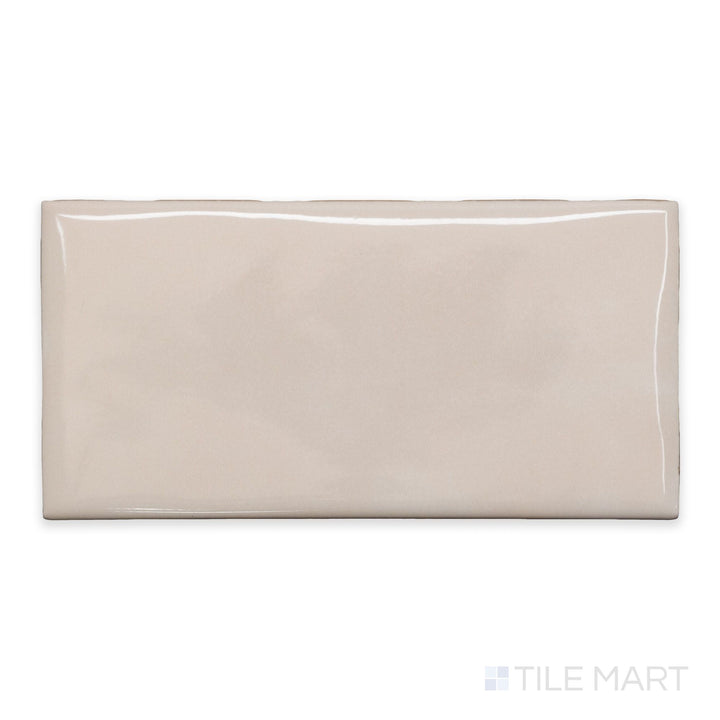An overview of Maiolica Biscuit 3x6 bright ceramic bullnose, featuring a warm neutral hue and high-shine ceramic glaze.