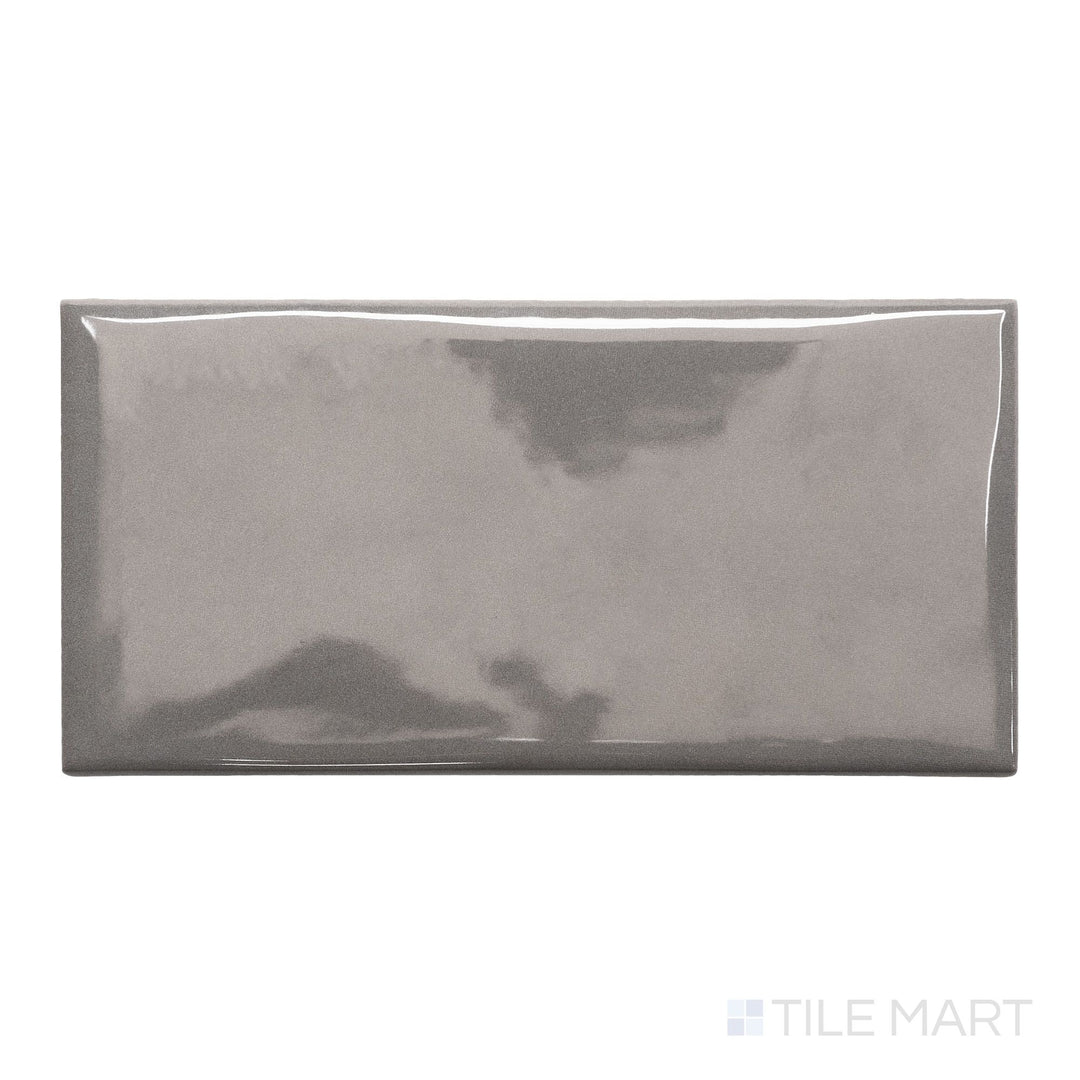 An overview of Maiolica Taupe 3x6 bright ceramic bullnose, featuring a warm taupe color and sleek, glossy finish.