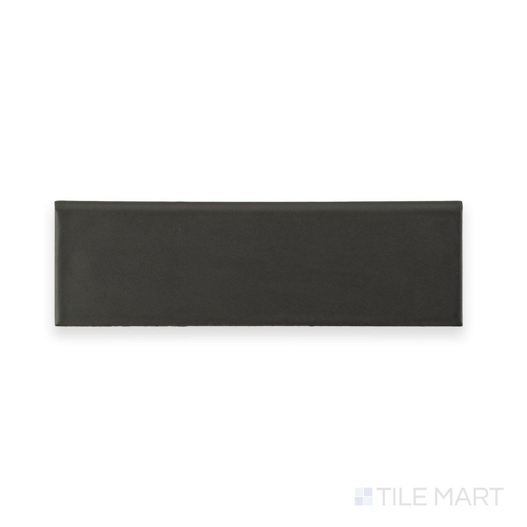 This full tile shot highlights the Maiolica Taupe 3x10 Matte ceramic bullnose tile’s earthy taupe shade, matte finish, and gently rounded edge.