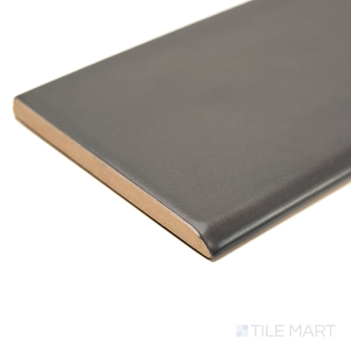 Maiolica Taupe 3x10 Matte ceramic bullnose tile shown from the corner, highlighting its warm taupe hue, matte finish, and rounded profile for polished wall ends.