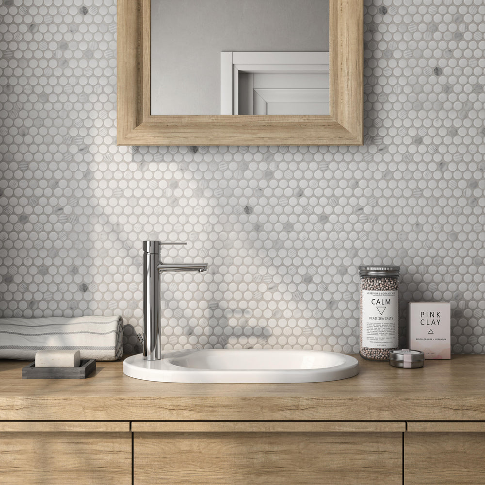 A seamless blend of elegance and durability, Rockart Carrara penny round matte and polished marble mosaic transforms any space into a refined masterpiece.