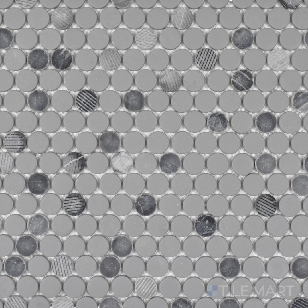 This bird’s-eye perspective of the Rockart Gray Penny Round mosaic showcases its mix of matte and polished granite with recycled glass, adding depth and texture to the classic round design.