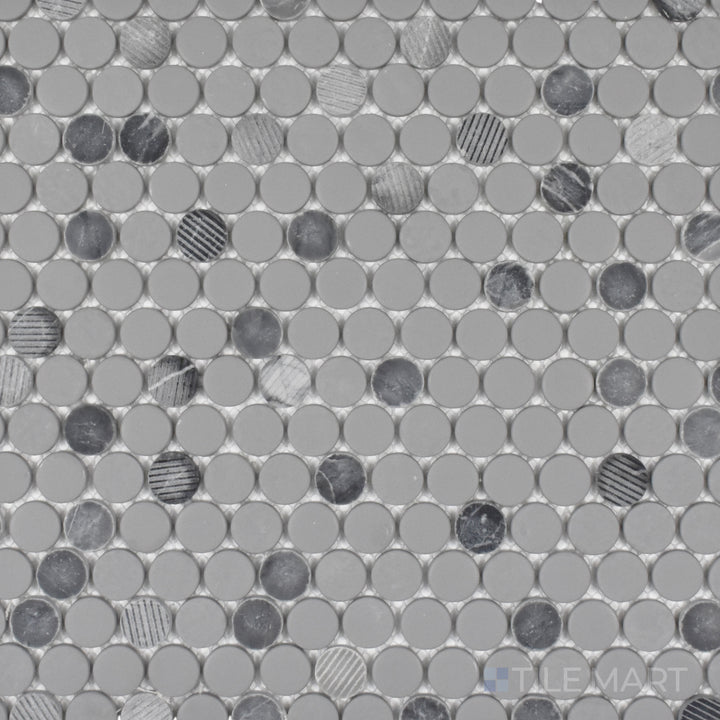 This bird’s-eye perspective of the Rockart Gray Penny Round mosaic showcases its mix of matte and polished granite with recycled glass, adding depth and texture to the classic round design.