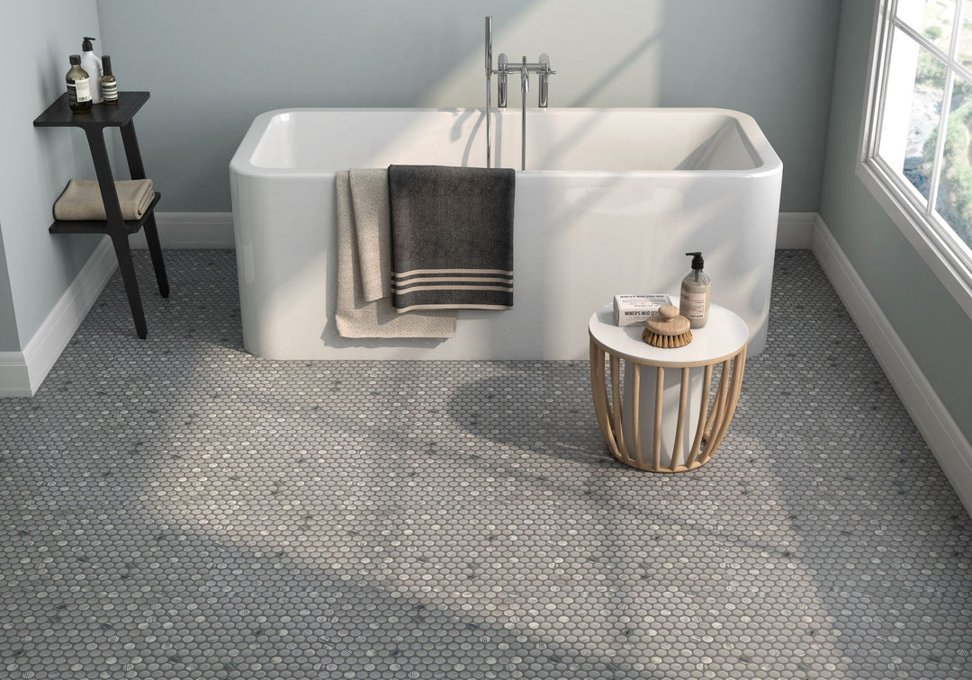 Rockart Gray penny round matte and polished granite mosaic offers a natural, earthy texture, perfect for contemporary and classic interiors alike.