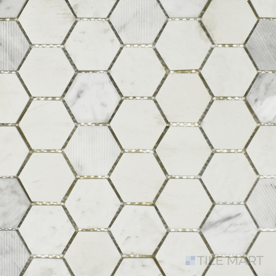 A top-down perspective of the Rockart Carrara Hexagon mosaic displays its matte and polished Carrara marble combined with recycled glass, arranged in a sleek hexagonal pattern.