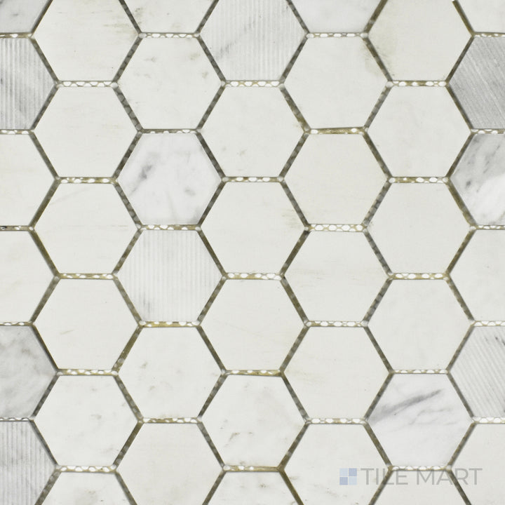 A top-down perspective of the Rockart Carrara Hexagon mosaic displays its matte and polished Carrara marble combined with recycled glass, arranged in a sleek hexagonal pattern.