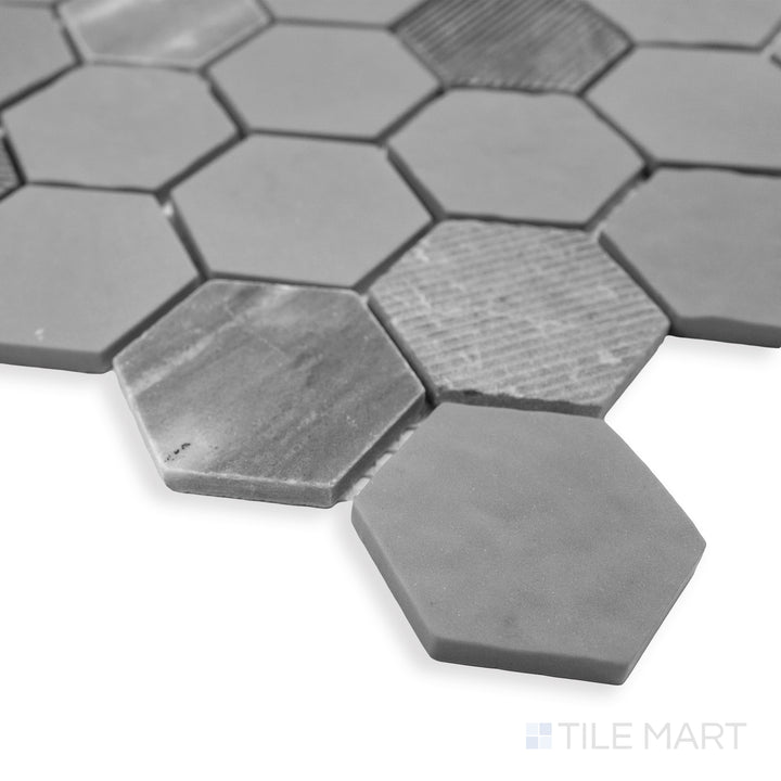 Rockart Gray Hexagon matte and polished granite mosaic in a corner view, highlighting its bold geometric pattern and recycled glass accents.