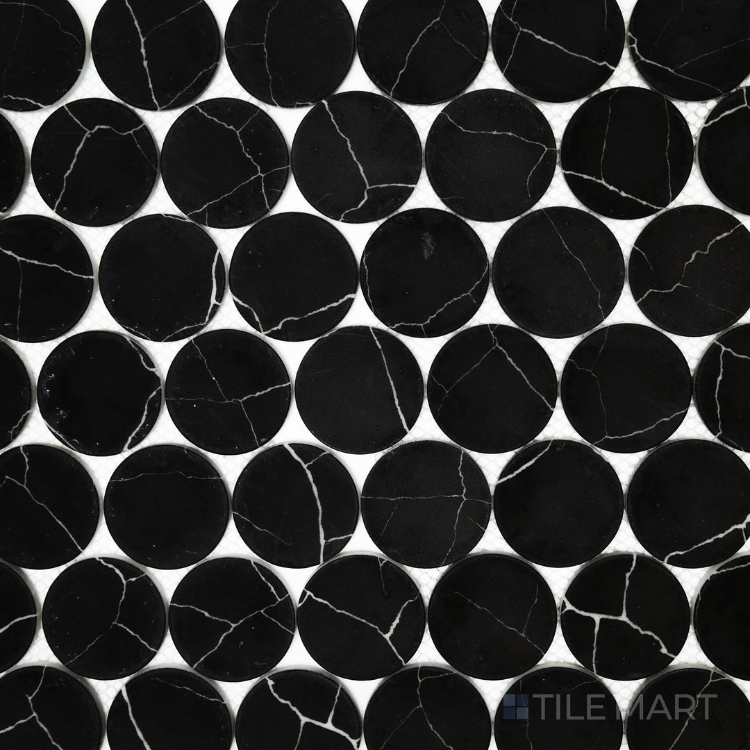 A high-angle view of the Rockart Nero Marquina Dots matte marble mosaic highlights its rich black marble with striking white veining, arranged in a refined dot pattern.