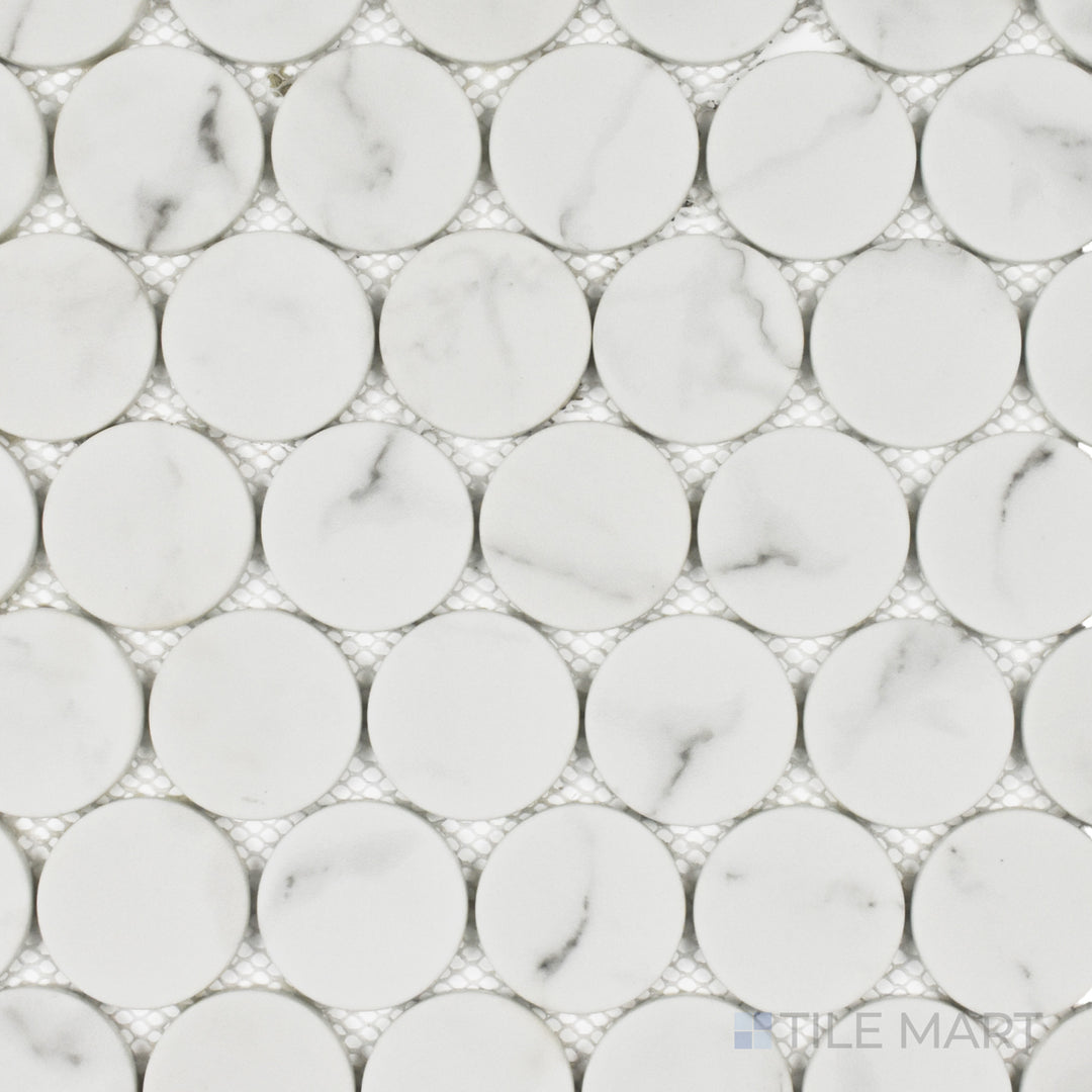 This top-down shot of the Rockart White Statuary Dots matte marble mosaic showcases its classic white marble with soft gray veining, arranged in a sleek and elegant dot design.