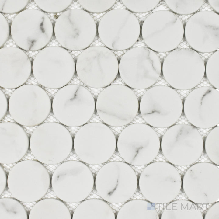 This top-down shot of the Rockart White Statuary Dots matte marble mosaic showcases its classic white marble with soft gray veining, arranged in a sleek and elegant dot design.