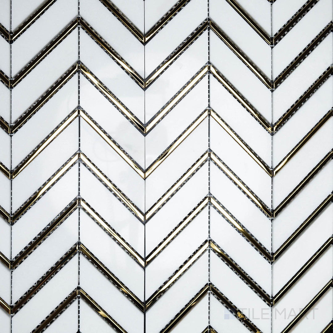 An overhead shot of the Rockart Thassos Metal Arrow Marble mosaic emphasizes its polished white Thassos marble with metal arrow inlays, creating a sleek and directional design.