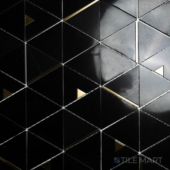 A top-down shot of the Rockart Nero Marquina Triangle Polished Mosaic presents its deep black marble with striking white veining, arranged in a bold triangular pattern.