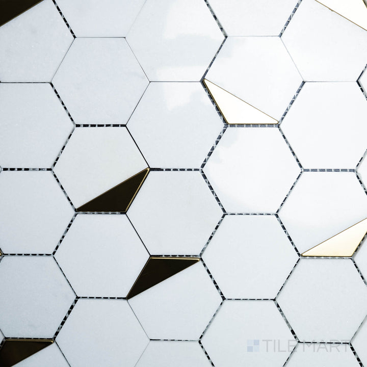 A top-down perspective of the Rockart Thassos Hexagon Polished Mosaic displays its classic white marble in a precise hexagonal arrangement, offering a timeless and elegant touch.