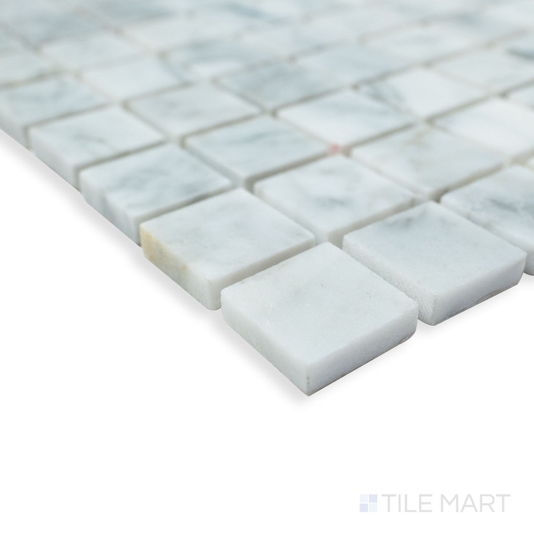 Rockart Carrara Marble 1" Square mosaic in a corner view, showcasing its crisp square layout and polished Carrara marble surface for a clean, elegant look.