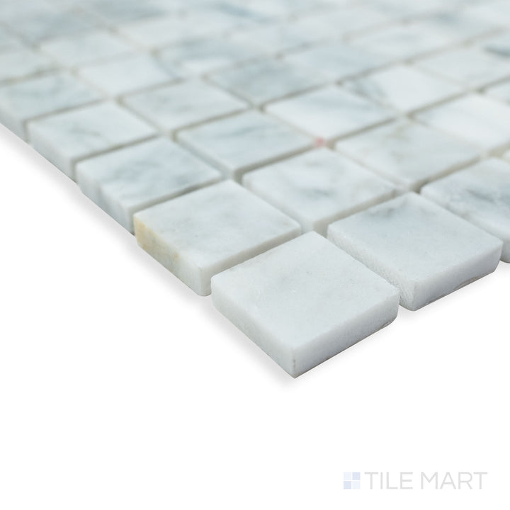 Rockart Carrara Marble 1" Square mosaic in a corner view, showcasing its crisp square layout and polished Carrara marble surface for a clean, elegant look.
