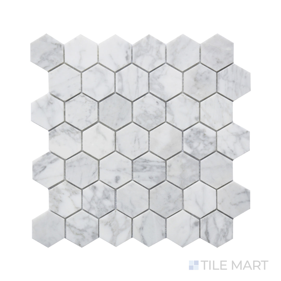 Detailed look at Rockart Carrara Marble 2" Hexagon Mosaic, where larger hexagonal tiles display the elegant veining and soft white tones of Carrara marble.