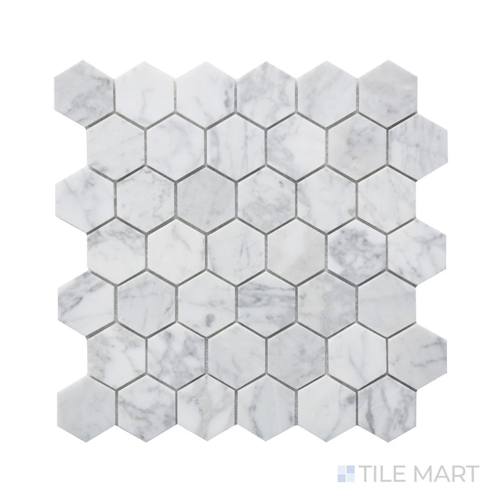 Detailed look at Rockart Carrara Marble 2" Hexagon Mosaic, where larger hexagonal tiles display the elegant veining and soft white tones of Carrara marble.