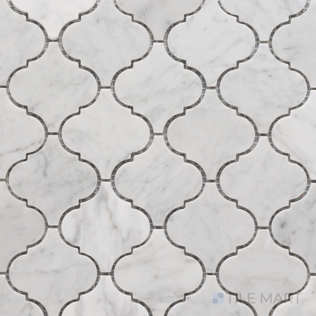 A top-down shot of the Rockart Carrara Marble Lantern Mosaic presents its graceful lantern-shaped white Carrara marble tiles, offering a luxurious and traditional appeal.