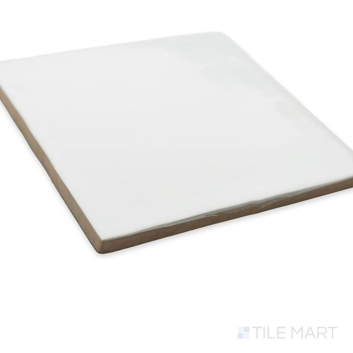 St. Tropez Blanco 5x5 bright ceramic tile in a corner shot, showcasing its crisp white hue and high-gloss finish for a clean, modern look.