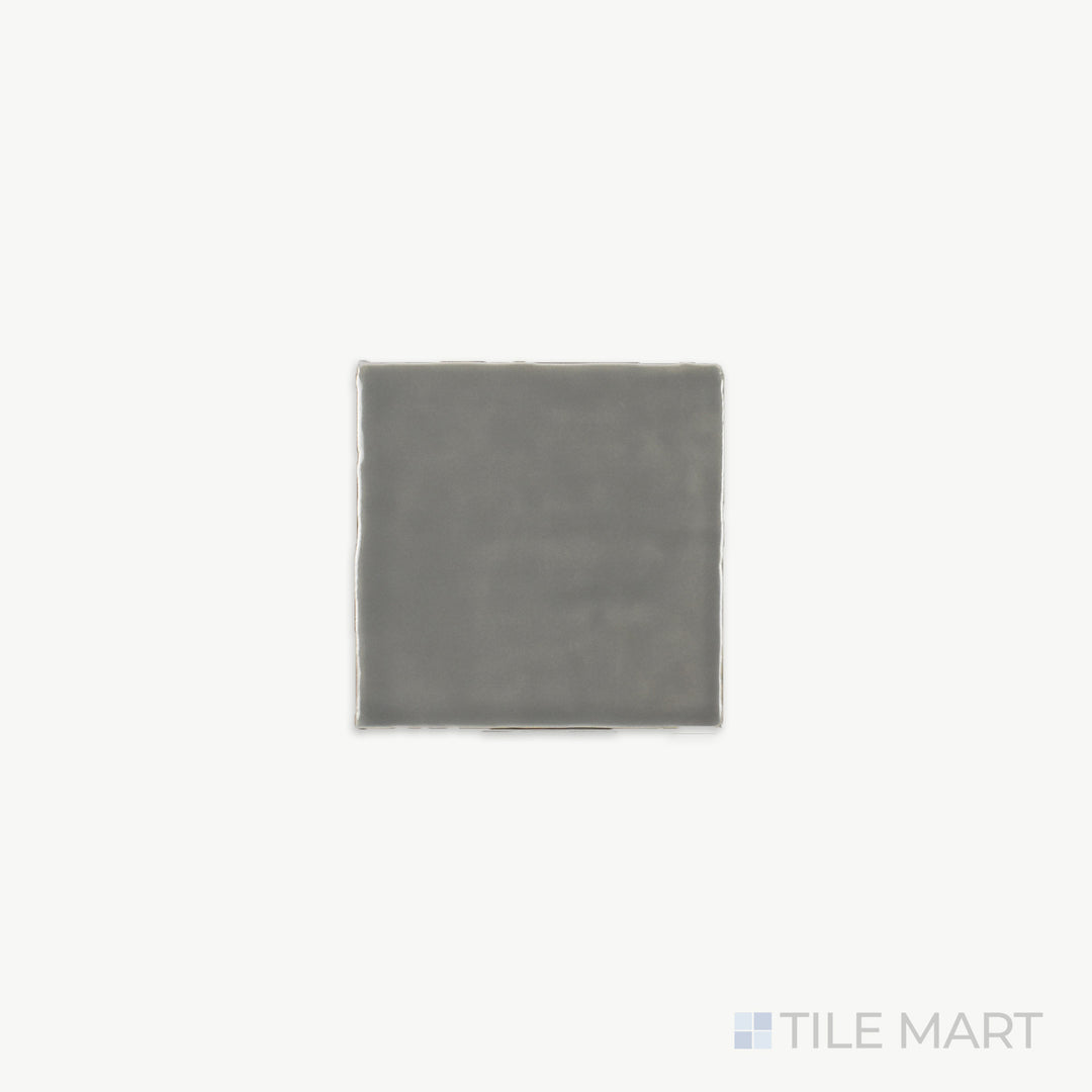 Zoomed-in view of St. Tropez Gris 5X5 Bright Ceramic, revealing its soft gray tone and glossy texture that adds a subtle yet sophisticated touch.