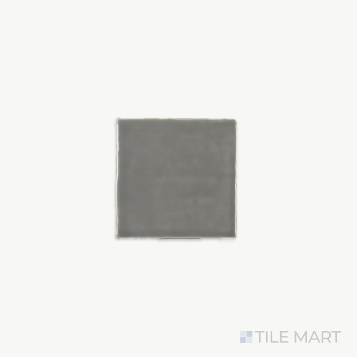 Zoomed-in view of St. Tropez Gris 5X5 Bright Ceramic, revealing its soft gray tone and glossy texture that adds a subtle yet sophisticated touch.