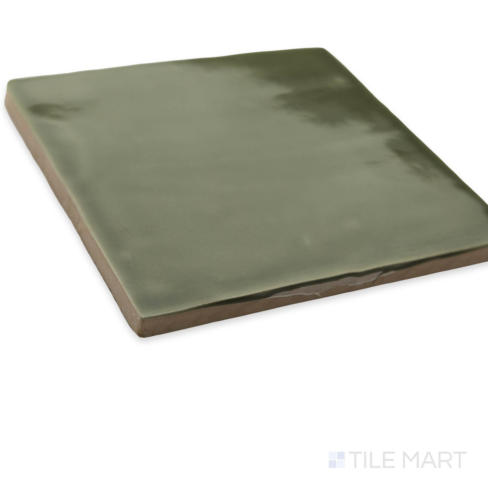 St. Tropez Verde 5x5 bright ceramic tile in a corner perspective, emphasizing its lively green hue and high-shine surface for a refreshing touch.