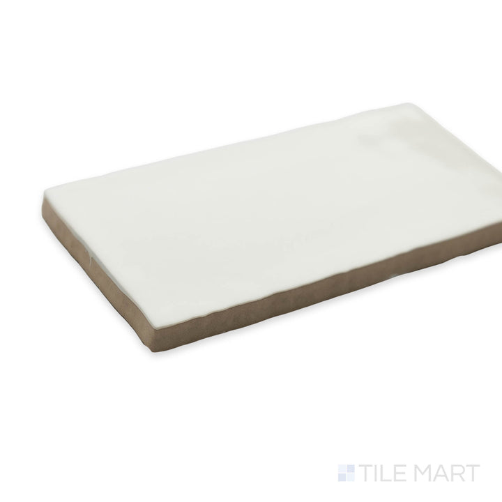 A sleek and timeless corner view of St. Tropez Blanco 2.5x5 bright ceramic tile, featuring its classic white tone and glossy finish.