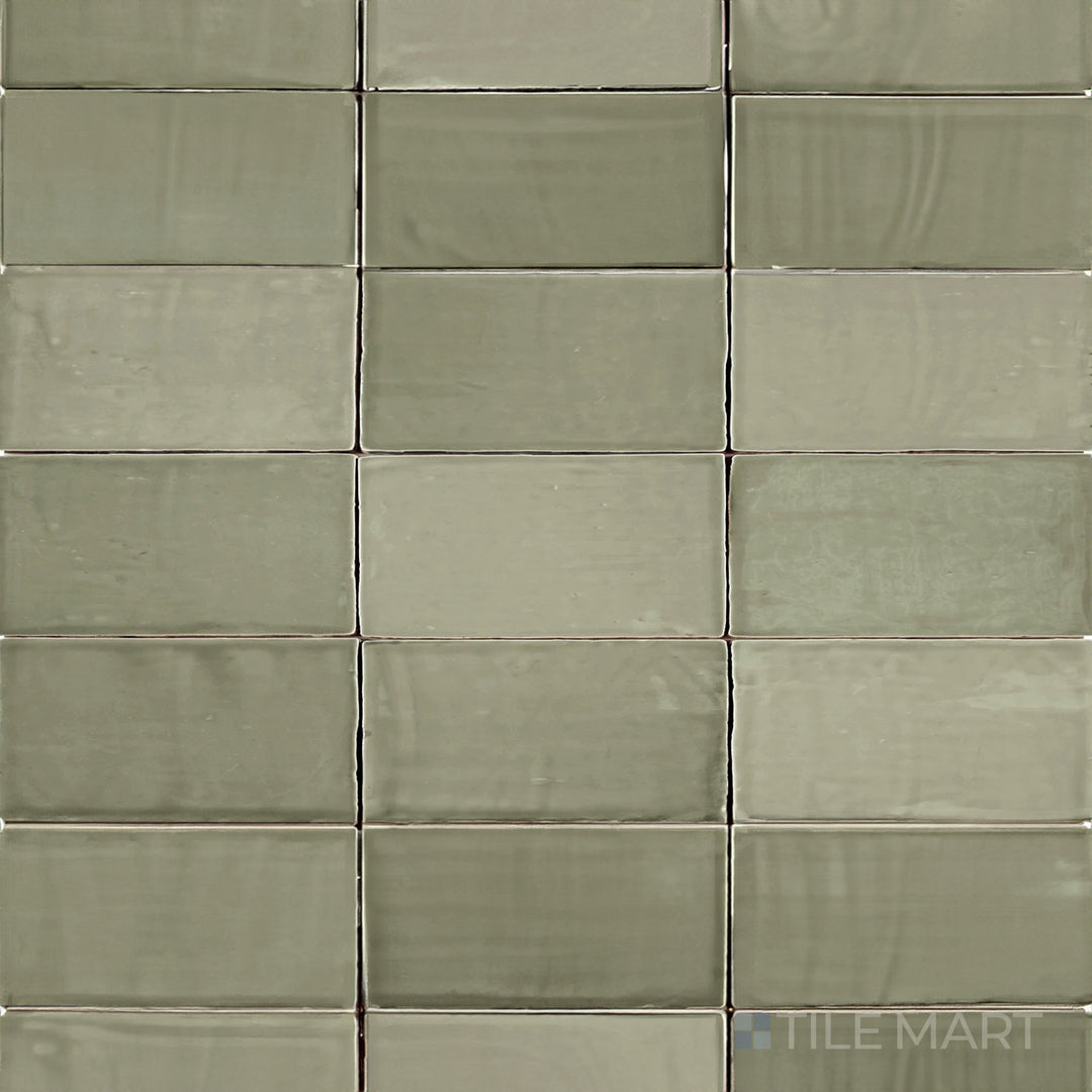 This bird’s-eye perspective of the St. Tropez Verde 2.5x5 inch bright ceramic tile showcases its fresh green shade with a polished surface, ideal for a lively and natural look.