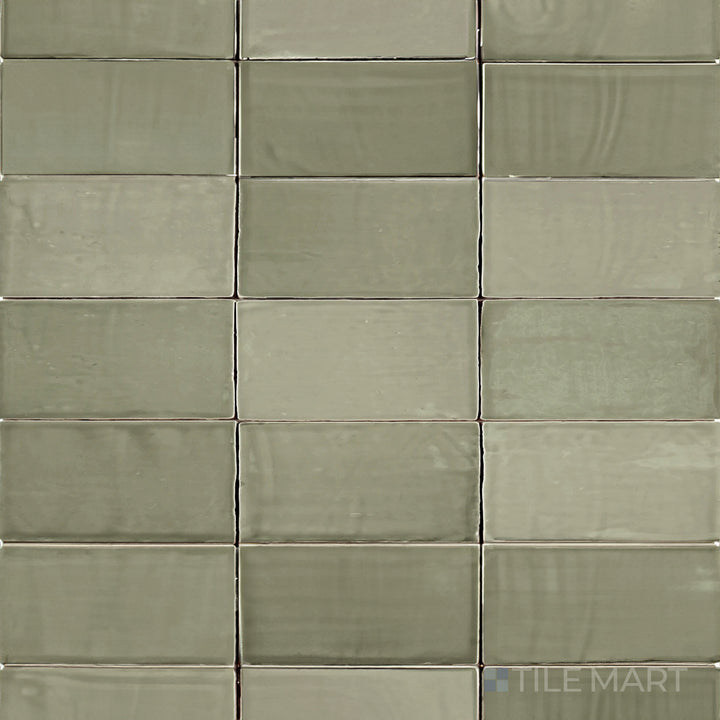This bird’s-eye perspective of the St. Tropez Verde 2.5x5 inch bright ceramic tile showcases its fresh green shade with a polished surface, ideal for a lively and natural look.