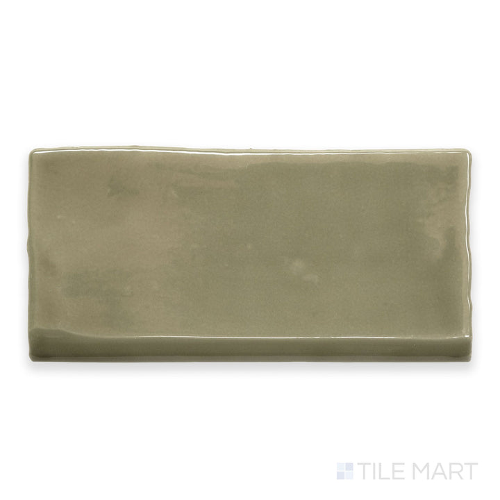 An overview of St. Tropez Verde 2.5x5 bright ceramic bullnose, featuring a vibrant green tone and a smooth, glossy surface.
