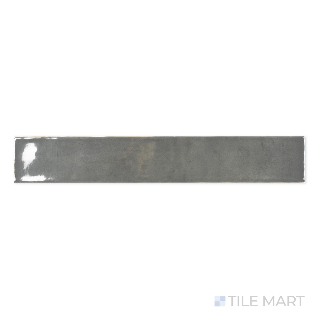 Detailed close-up of Zellige Dark Gray 2X16 Bright Ceramic, highlighting its bold charcoal tone and high-gloss finish for a modern touch.