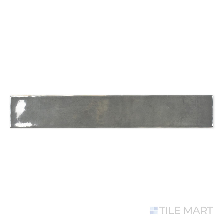 Detailed close-up of Zellige Dark Gray 2X16 Bright Ceramic, highlighting its bold charcoal tone and high-gloss finish for a modern touch.