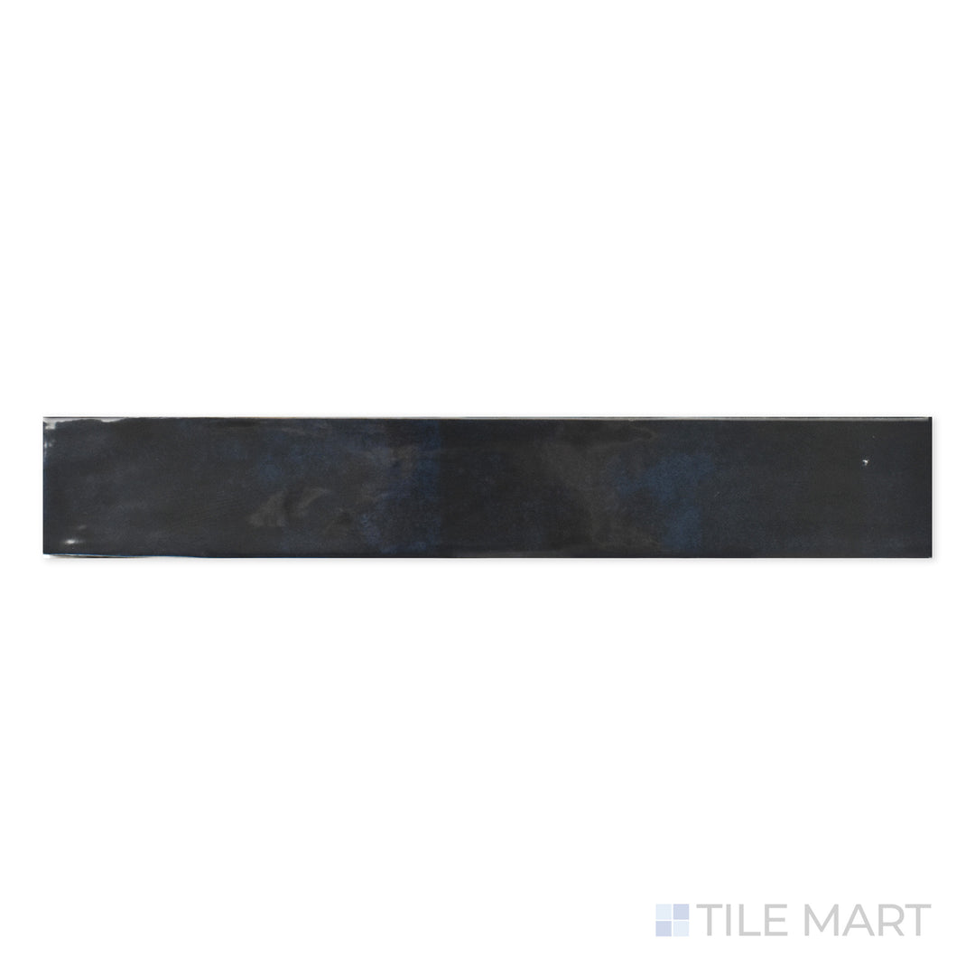 Close-up of Zellige Deep Blue 2X16 Bright Ceramic, featuring a rich navy shade and a polished ceramic surface that enhances color vibrancy.