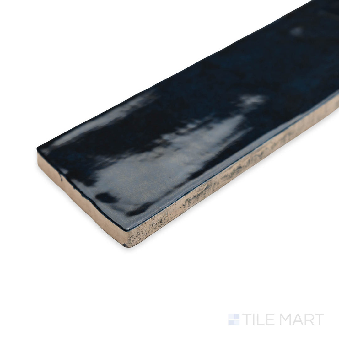 Zellige Deep Blue 2x16 bright ceramic tile in a close-up corner perspective, highlighting its rich blue tone and high-gloss handcrafted texture.