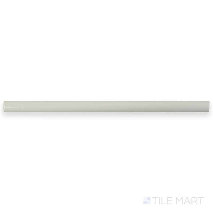 A flat lay of Zellige White 0.75x16 Bright ceramic pencil tile, highlighting its slender shape, glossy white surface, and clean linear form.