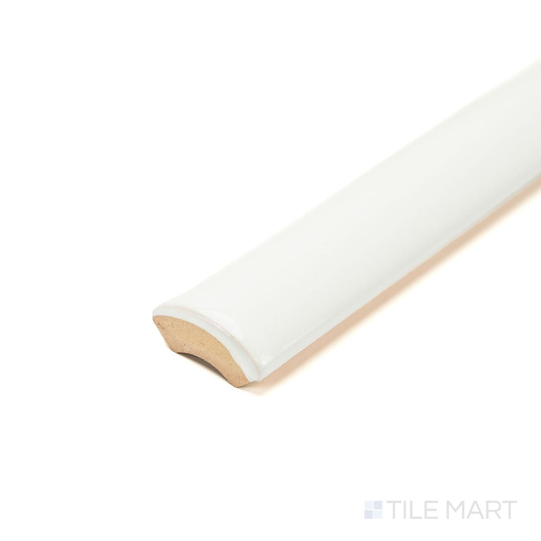 Zellige White 0.75x16 Bright ceramic pencil tile seen at an angle, featuring a slim linear shape, glossy finish, and smooth rounded edge—ideal for crisp trim details.