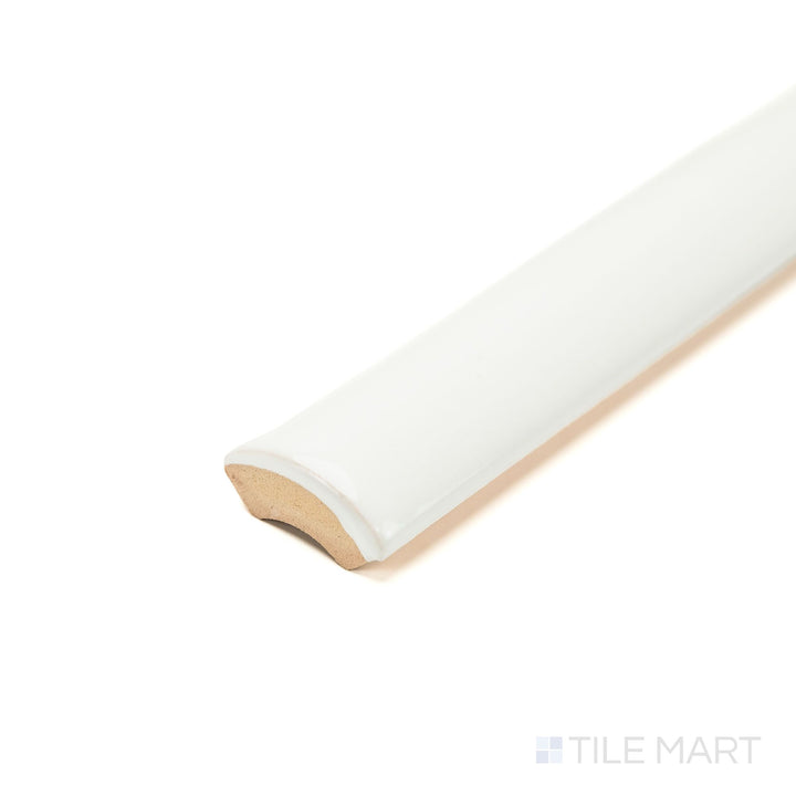 Zellige White 0.75x16 Bright ceramic pencil tile seen at an angle, featuring a slim linear shape, glossy finish, and smooth rounded edge—ideal for crisp trim details.