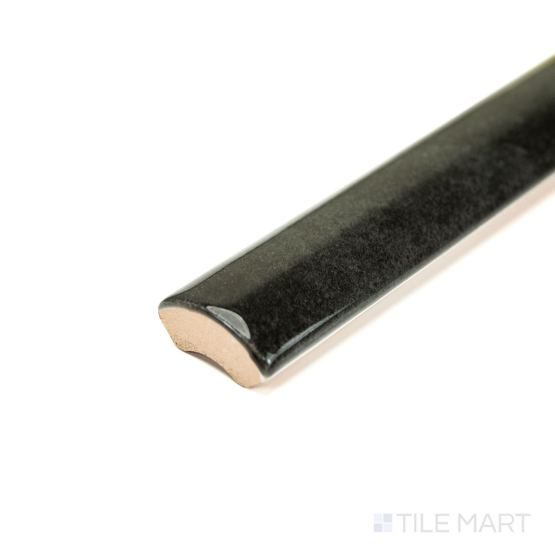 Zellige Dark Gray 0.75x16 Bright ceramic pencil tile shown from a corner, featuring a deep gray glaze and clean narrow profile—perfect for decorative edging.