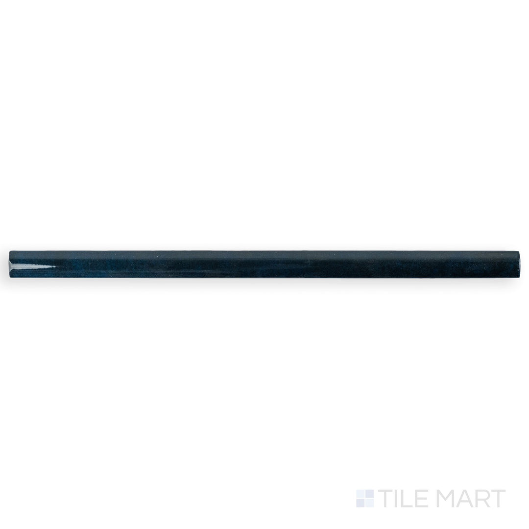 Top-down image of Zellige Deep Blue 0.75x16 Bright ceramic pencil tile, emphasizing its intense blue gloss and pencil-thin trim profile.
