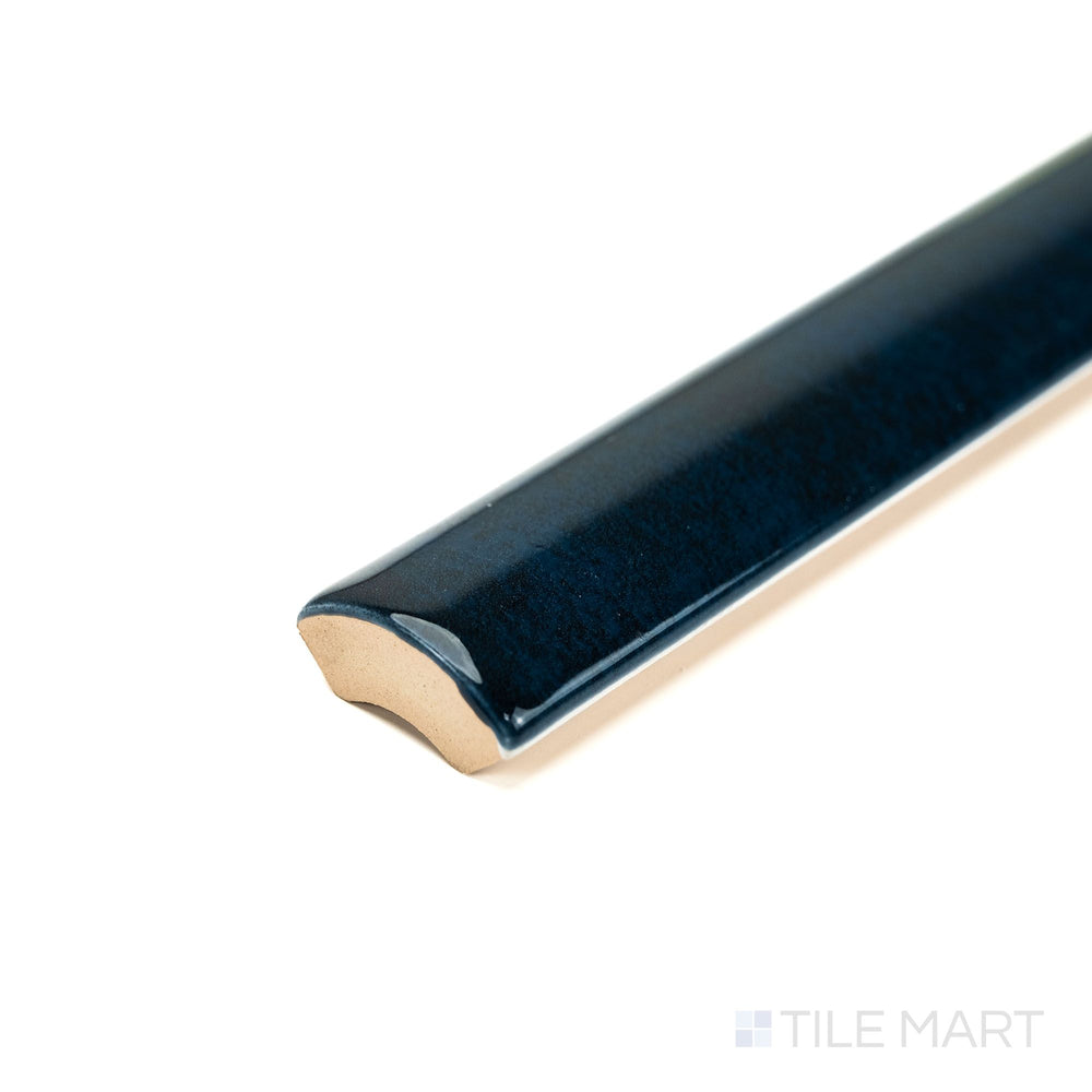 Corner view of Zellige Deep Blue 0.75x16 Bright ceramic pencil tile, showcasing its intense blue gloss and slim profile—ideal for accent lines and edge trims.
