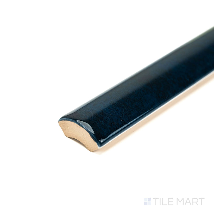 Corner view of Zellige Deep Blue 0.75x16 Bright ceramic pencil tile, showcasing its intense blue gloss and slim profile—ideal for accent lines and edge trims.