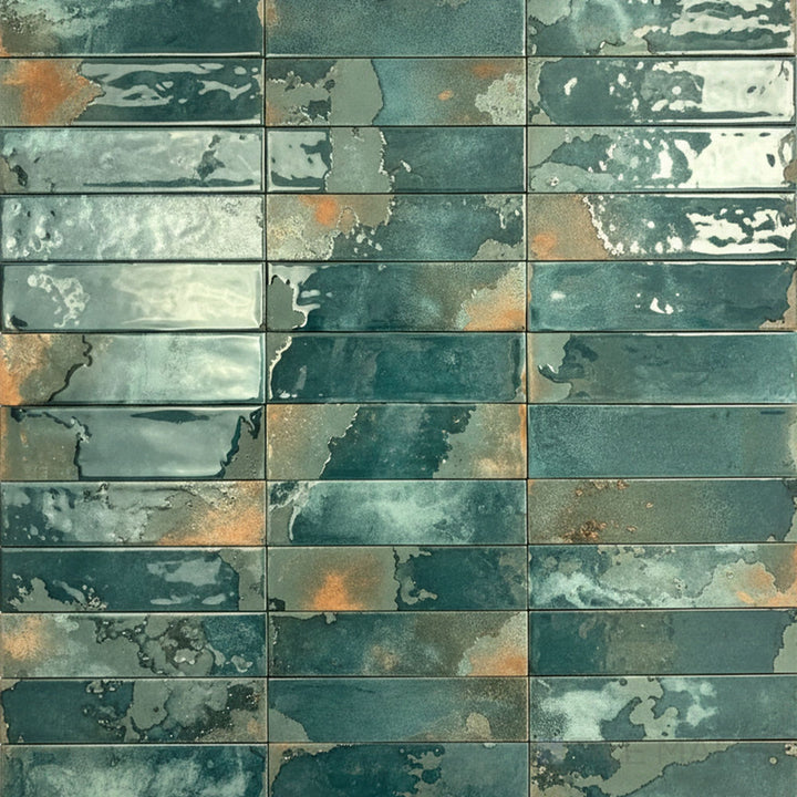 Rich emerald tones and a glossy finish give this 2.5x9 porcelain tile a bold and elegant look.