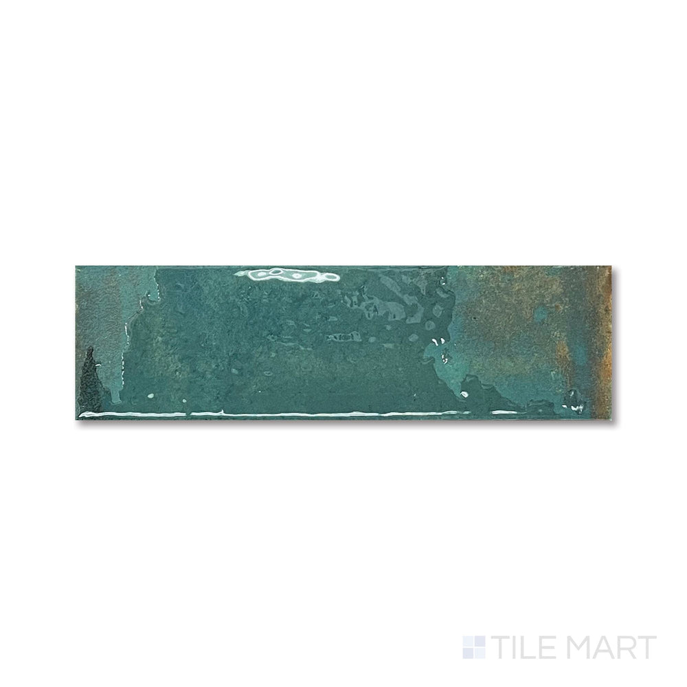 Overhead perspective highlighting the deep emerald gloss and slim rectangular shape of the Granadella Esmeralda tile.