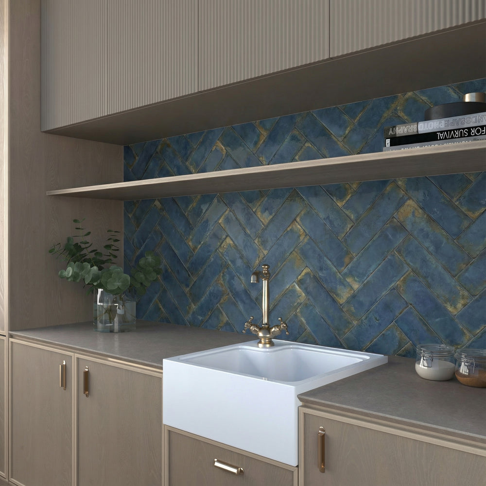 Glossy blue tile feature wall in a modern bathroom with white fixtures.