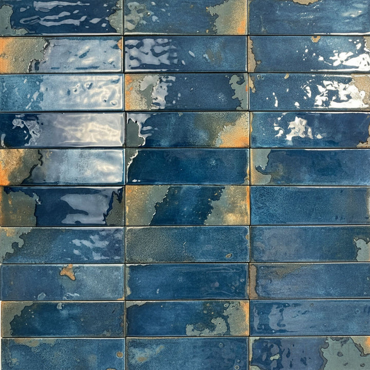 Featuring a deep navy glaze, this glossy 2.5x9 porcelain tile adds richness with a smooth, reflective surface.