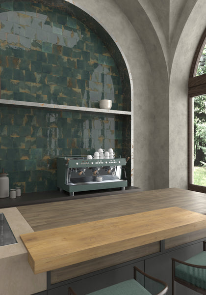 Green glossy tiles create a bold kitchen backsplash with wood accents.