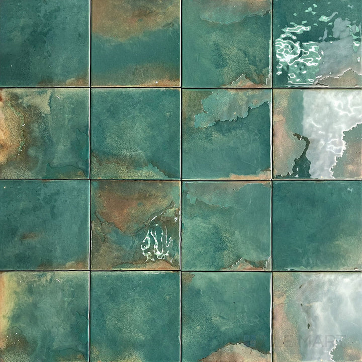 Lush emerald green coloring and a high-gloss finish define this 4.5x4.5 porcelain tile's vibrant appearance.