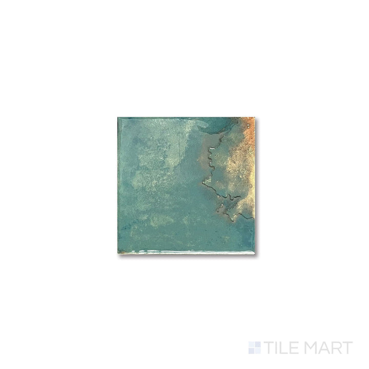 Flat lay image showing the vibrant emerald gloss and compact square shape of the Granadella Esmeralda tile.